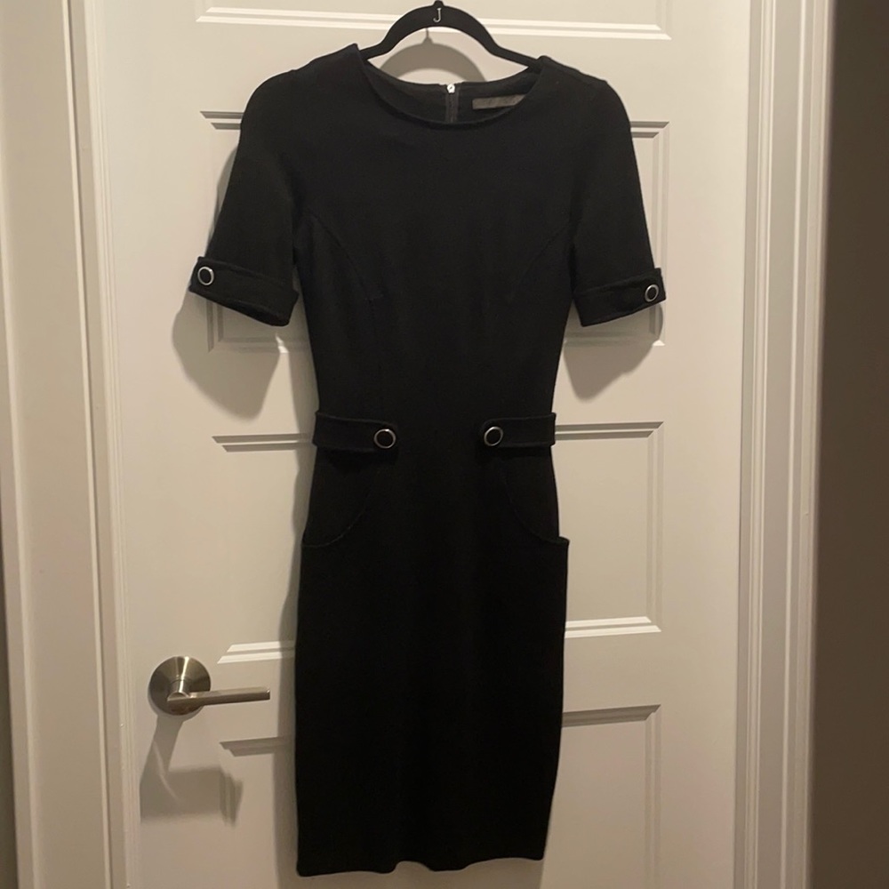 Nice thick material, button details on sleeves and waist